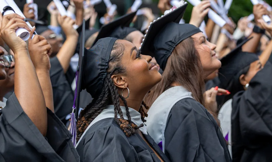 Students at graduation in cap and gown