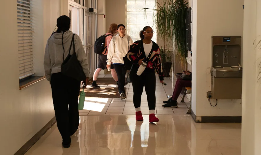 Students walking through a hallway